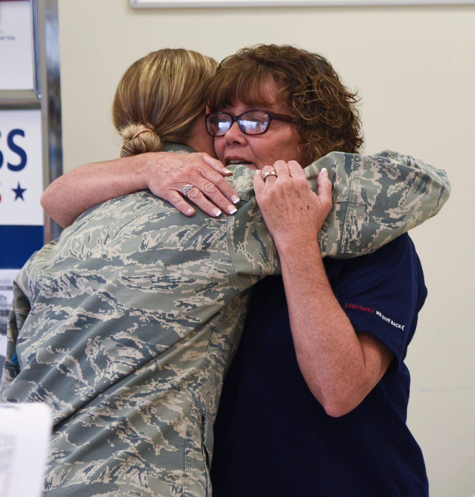 Sherri Oster, Sioux Falls Base Exchange store manager, hugged an Airman of the 114th Fighter Wing at her last unit training assembly, Aug. 6, 2017, Joe Foss Field, S.D.