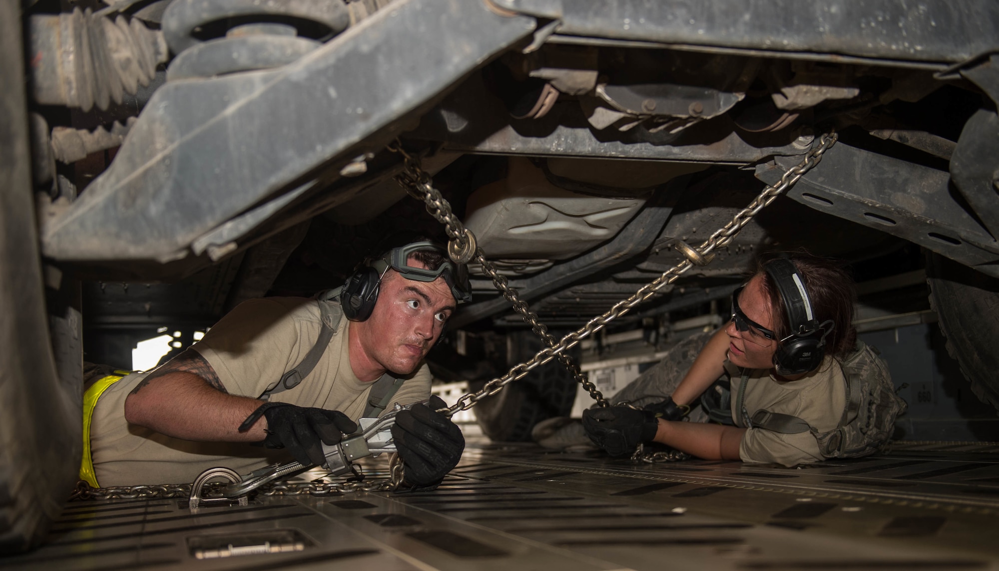 Airmen working on vehicles