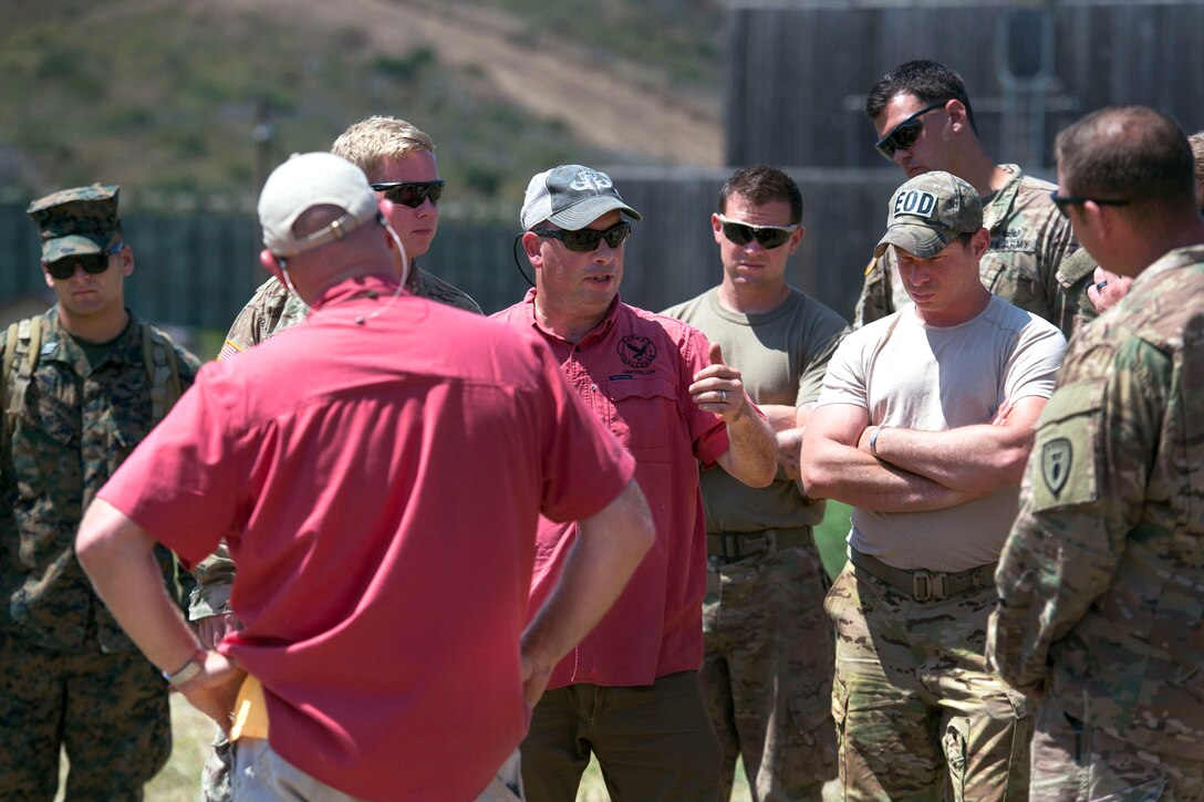 Briefing explosive ordnance disposal units.