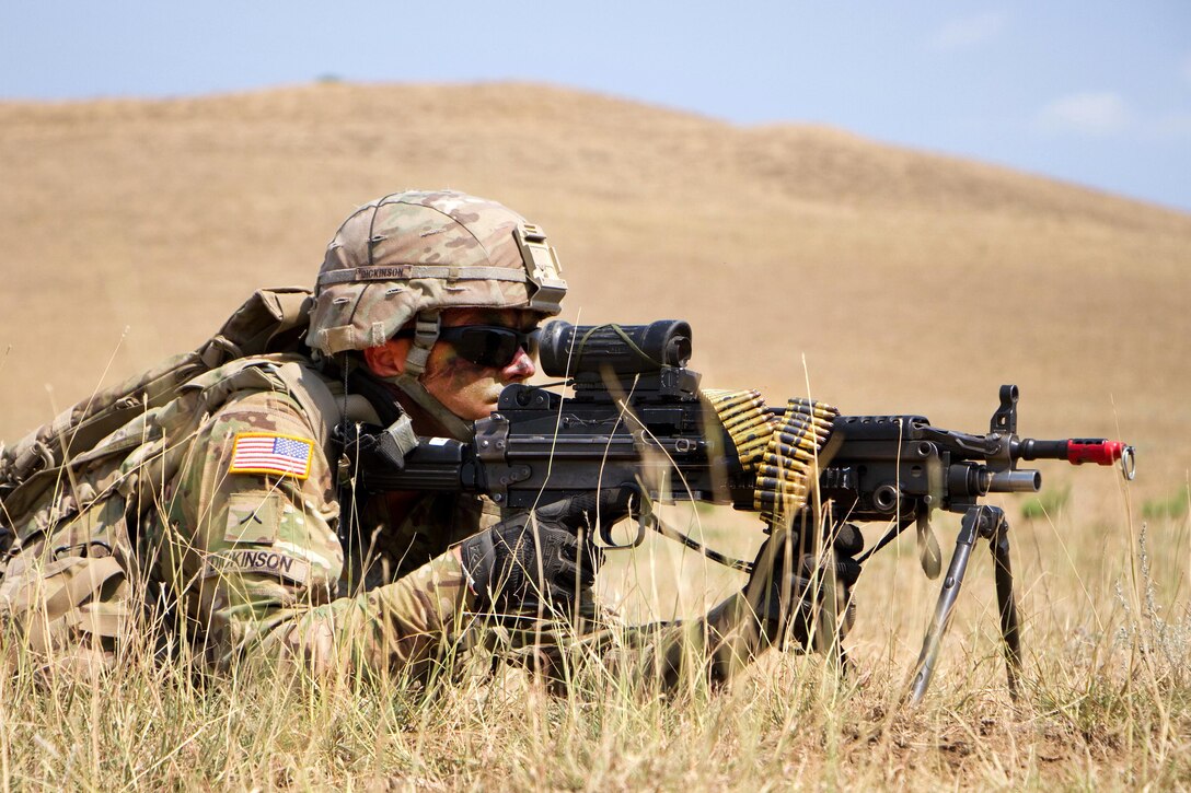 A soldier provides security and ready to fire his weapon on a dismounted patrol.
