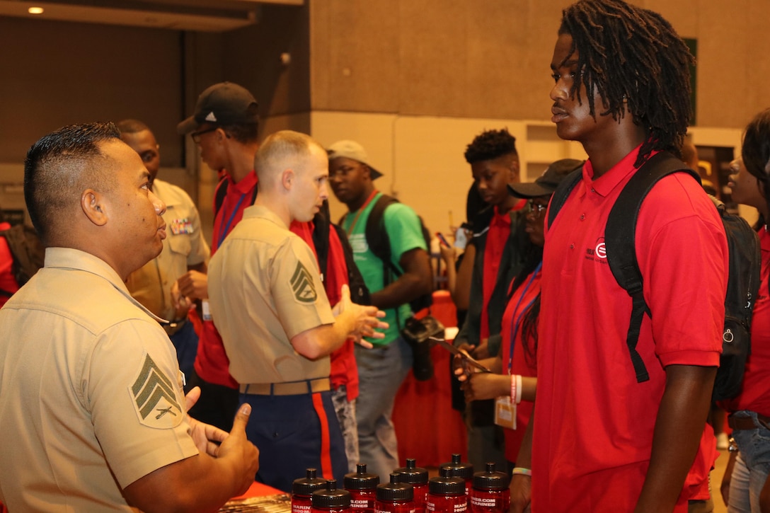 Marines with Marine Corps Recruiting Command and Recruiting Station St. Louis interact and engage with students at the College Fair during the National Urban League Youth Leadership Summit at the St. Louis Convention Center on July 29, 2017. The theme for this year’s Youth Summit was “Show Me: Turn Talk Into Action.” (U.S. Marine Corps photo by Sgt. Jennifer Webster/Released)