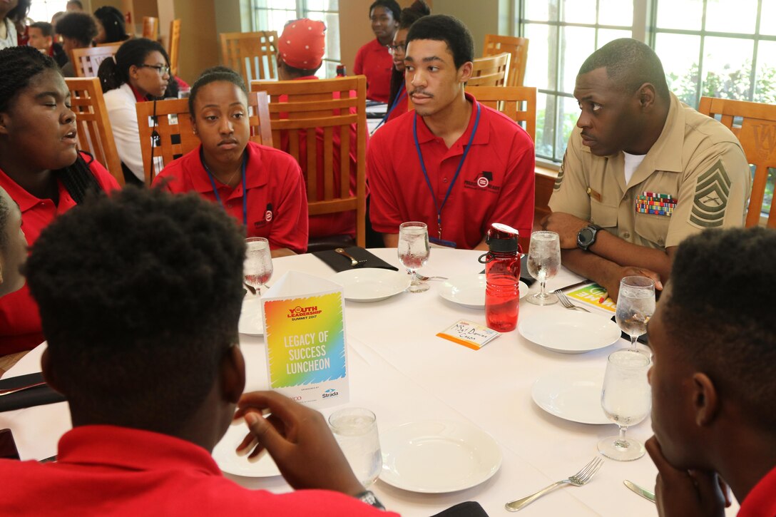 Marines with Marine Corps Recruiting Command and Recruiting Station St. Louis interact and engage with students at the Youth Legacy of Success Luncheon and Awards Ceremony during the National Urban League Youth Leadership Summit in St. Louis on July 29, 2017. The theme for this year’s Youth Summit was “Show Me: Turn Talk Into Action.” (U.S. Marine Corps photo by Sgt. Jennifer Webster/Released)