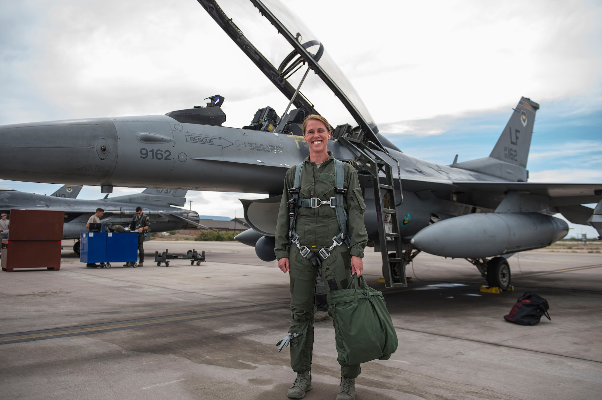 2nd Lt. Taylor O’Neil, Uniformed Services University of Health Sciences medical student, poses in front of an F-16 Fighting Falcon prior to take off at Holloman Air Force Base, N.M., July 28, 2017. Members from the 54th Fighter Group hosted USU medical students during the summer operational experience program, which is for first-year medical students transitioning to their second year of medical school. Future flight surgeon hopefuls were given familiarization flights as part of an inside look into what pilots go through in order to better provide care for pilots. (U.S. Air Force photo by Senior Airman Chase Cannon)