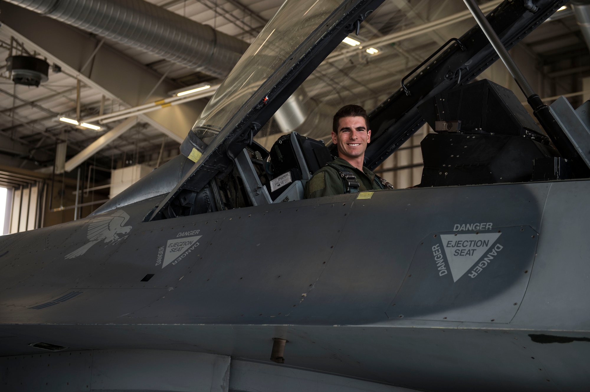 2nd Lt. Nathaniel Ford, Uniformed Services University of Health Sciences medical student, poses in an F-16 Fighting Falcon prior to take off at Holloman Air Force Base, N.M., July 28, 2017. Members from the 54th Fighter Group hosted USU medical students during the summer operational experience program, which is for first-year medical students transitioning to their second year of medical school. Future flight surgeon hopefuls were given familiarization flights as part of an inside look into what pilots go through in order to better provide care for pilots. (U.S. Air Force photo by Senior Airman Chase Cannon)