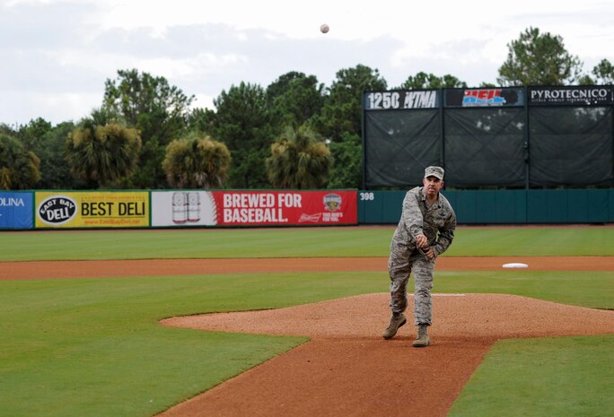 U.S. Air Force Col. Patrick Winstead, 437th Airlift Wing vice commander, throws a ceremonial first pitch during the Charleston RiverDogs Military Appreciation Night at Joseph P. Riley Jr. Park, Aug. 3, 2017.