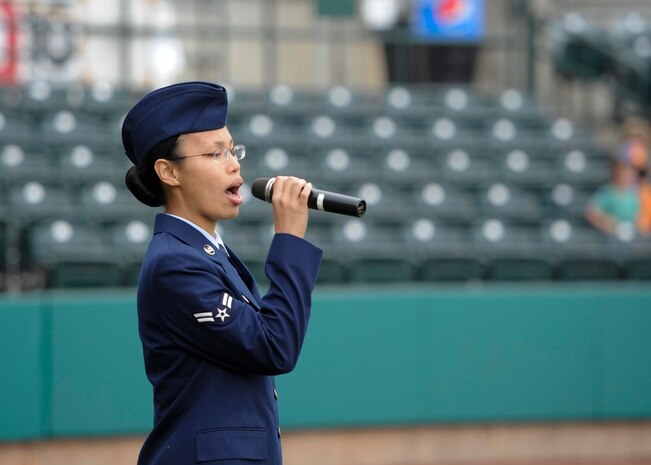 U.S. Air Force Airman 1st Class Angelia Sutarto, 437th Aircraft Maintenance Squadron crew chief, sings “The Star-Spangled Banner” during the Charleston RiverDogs Military Appreciation Night at Joseph P. Riley Jr. Park, Aug. 3, 2017.
