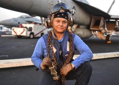 ARABIAN GULF (Aug 4, 2017) U.S. Navy Airman Michaell Lathrop, from Atlanta, poses for a photo aboard the aircraft carrier USS Nimitz (CVN 68), Aug. 4, 2017, in the Arabian Gulf. Nimitz is deployed in the U.S. 5th Fleet area of operations in support of Operation Inherent Resolve. While in this region, the ship and strike group are conducting maritime security operations to reassure allies and partners, preserve freedom of navigation, and maintain the free flow of commerce. (U.S. Navy photo by Mass Communication Specialist 3rd Class Ian Kinkead)
