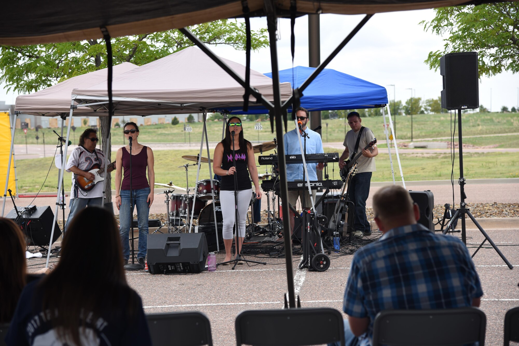 A live band performs for 310th Space Wing members attending the wing's annual family picnic