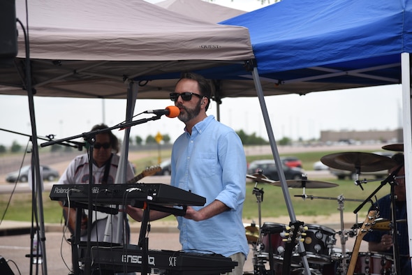 A live band performs for 310th Space Wing members attending the wing's annual family picnic