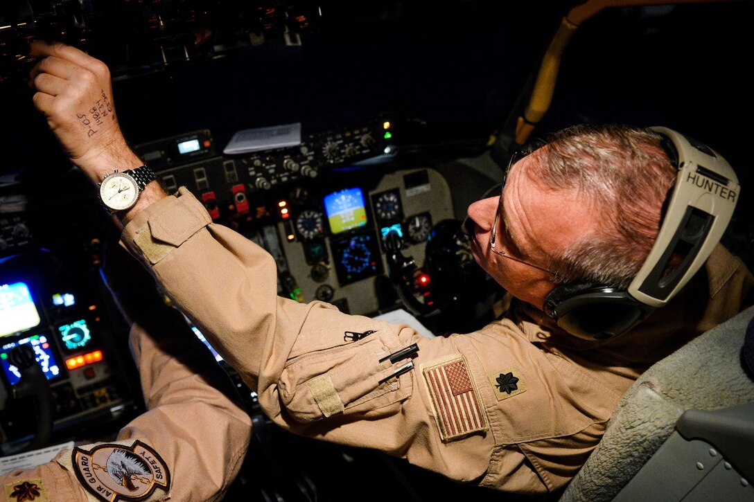 Air Force pilot performs a systems check inside the cockpit.