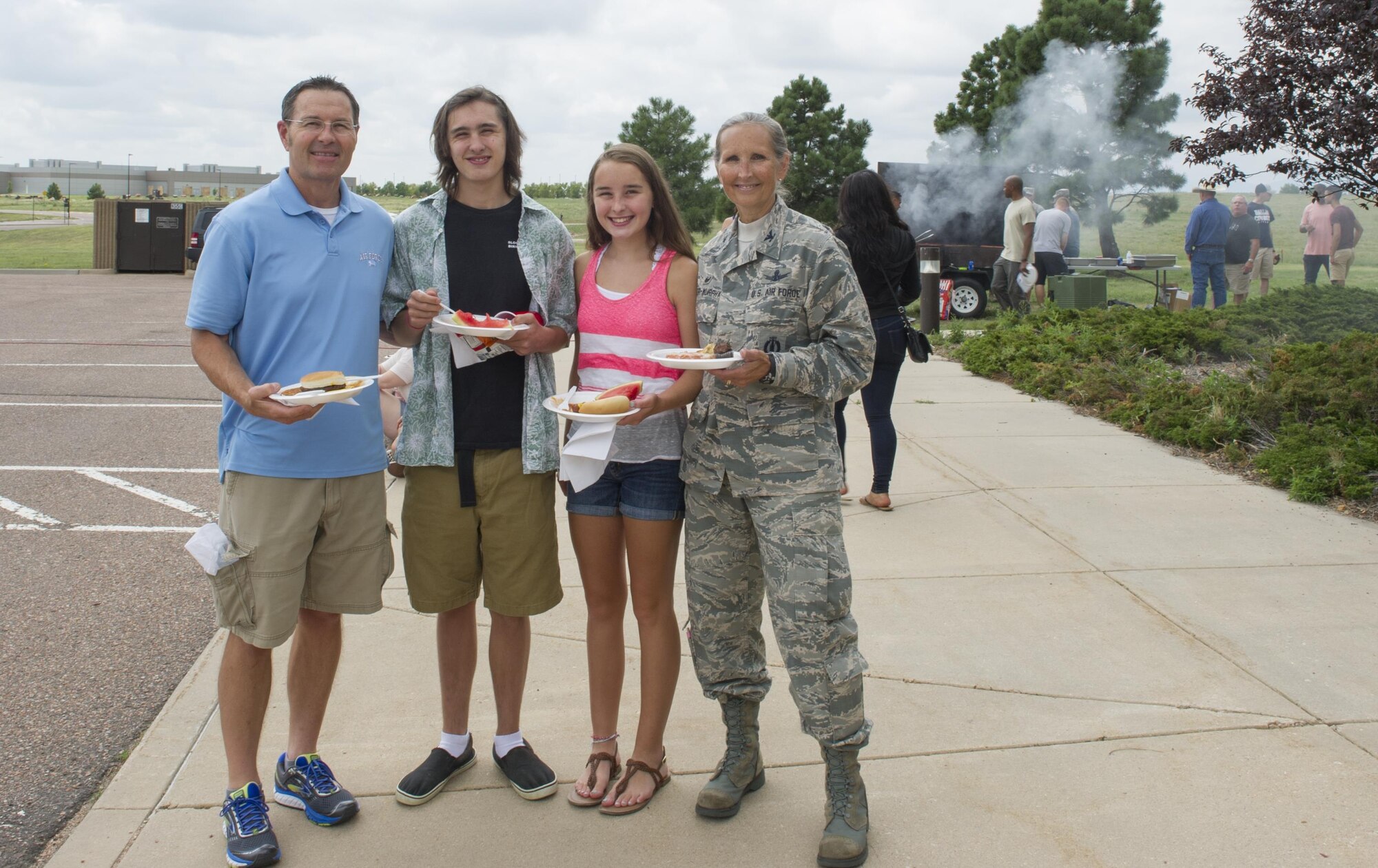 Col. Traci Kueker-Murphy, 310th Space Wing commander, poses for a photo with her husband, James, son, Jacob, and daughter, McClain