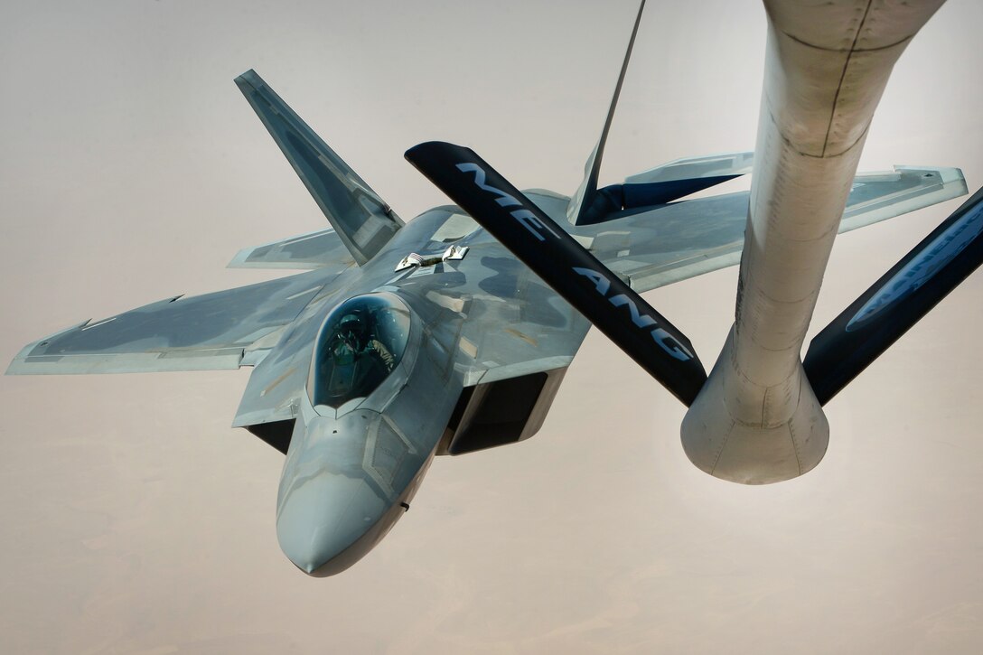 An Air Force F-22 Raptor departs after receiving fuel.