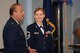 U.S. Air National Guard Senior Master Sgt. June E. Fonteyne, a health systems technician with the 157th Medical Group, looks on as U.S. Air National Guard Lt. Col. Philip A. Plourde, the acting 157th MDG commander, talked about the contributions that she made during her service with the 157th MDG, August 5, 2017 at Pease Air National Guard Base, N.H.