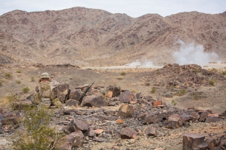 Cpl. Blake Arnold, forward observer, mortarman, 1st Battalion, 1st Marine Regiment, calculates the target coordinates during an individual training exercise at Range 410A aboard the Marine Corps Air Ground Combat Center, Twentynine Palms, Calif., July 25, 2017. 1/1 is based out of Marine Corps Base Campy Pendleton, Calif., and is serving as part of the GCE during ITX 5-17. (U.S. Marine Corps photo by Pfc. Margaret Gale)