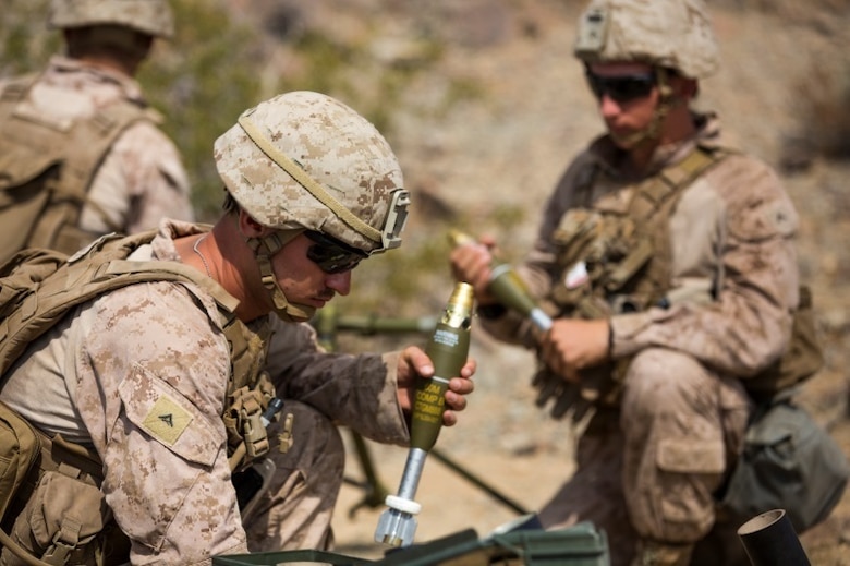 Marines from 1st Battalion, 1st Marine Regiment, prepare for a rapid fire on the enemy target during an individual training exercise at Range 410A aboard the Marine Corps Air Ground Combat Center, Twentynine Palms, Calif., July 25, 2017. 1/1 is based out of Marine Corps Base Camp Pendleton, Calif., and is serving as part of the GCE during ITX 5-17. (U.S. Marine Corps photo by Pfc. Margaret Gale)