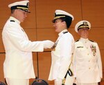 Cmdr. Karen Muntean, former commanding officer of Navy Recruiting District San Antonio, was awarded the Meritorious Service Medal by Capt. Jason Webb, commodore, Navy Recruiting Region West, during a change of command ceremony held at the Luella Bennack Music Center on the campus of the University of the Incarnate Word Aug. 4.