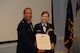 U.S. Air National Guard Lt. Col. Philip A. Plourde, the acting 157th Medical Group commander presents U.S. Air National Guard Senior Master Sgt. June E. Fonteyne, a health systems technician with the 157th MDG with her retirement certificate August 5, 2017 at Pease Air National Guard Base, N.H.
