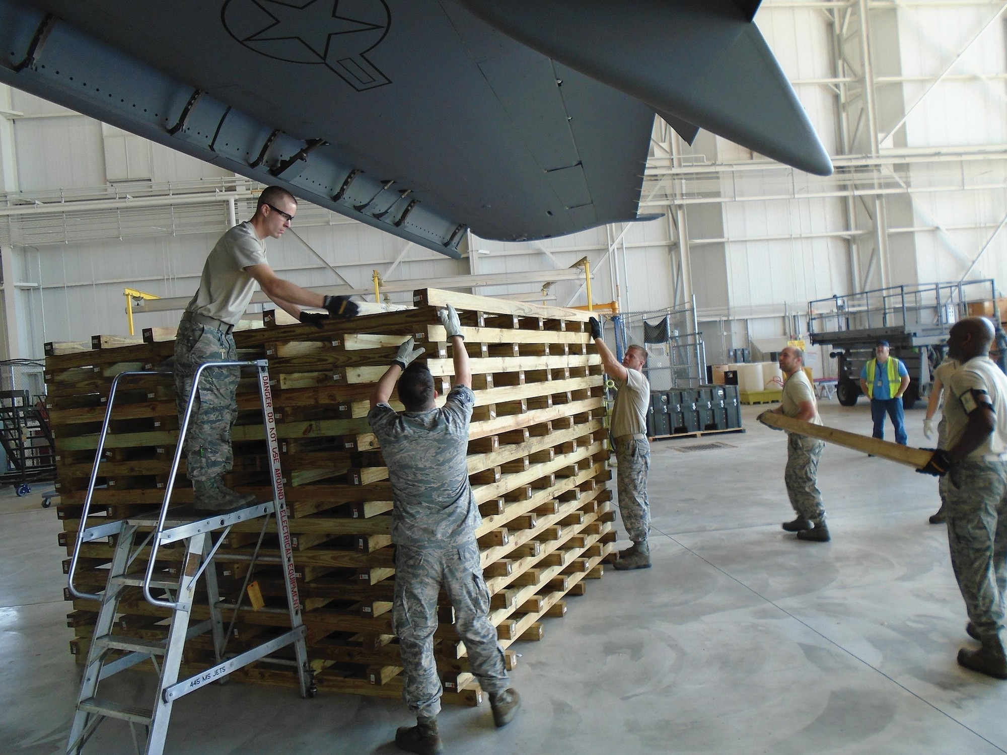 445th Maintenance Group Crash Damage or Disabled Aircraft Recovery (CDDAR) members uncrate a lift bag container in preparation for the CDDAR exercise July 17, 2017. (U.S. Air Force photo/Master Sgt. Patrick O’Reilly)