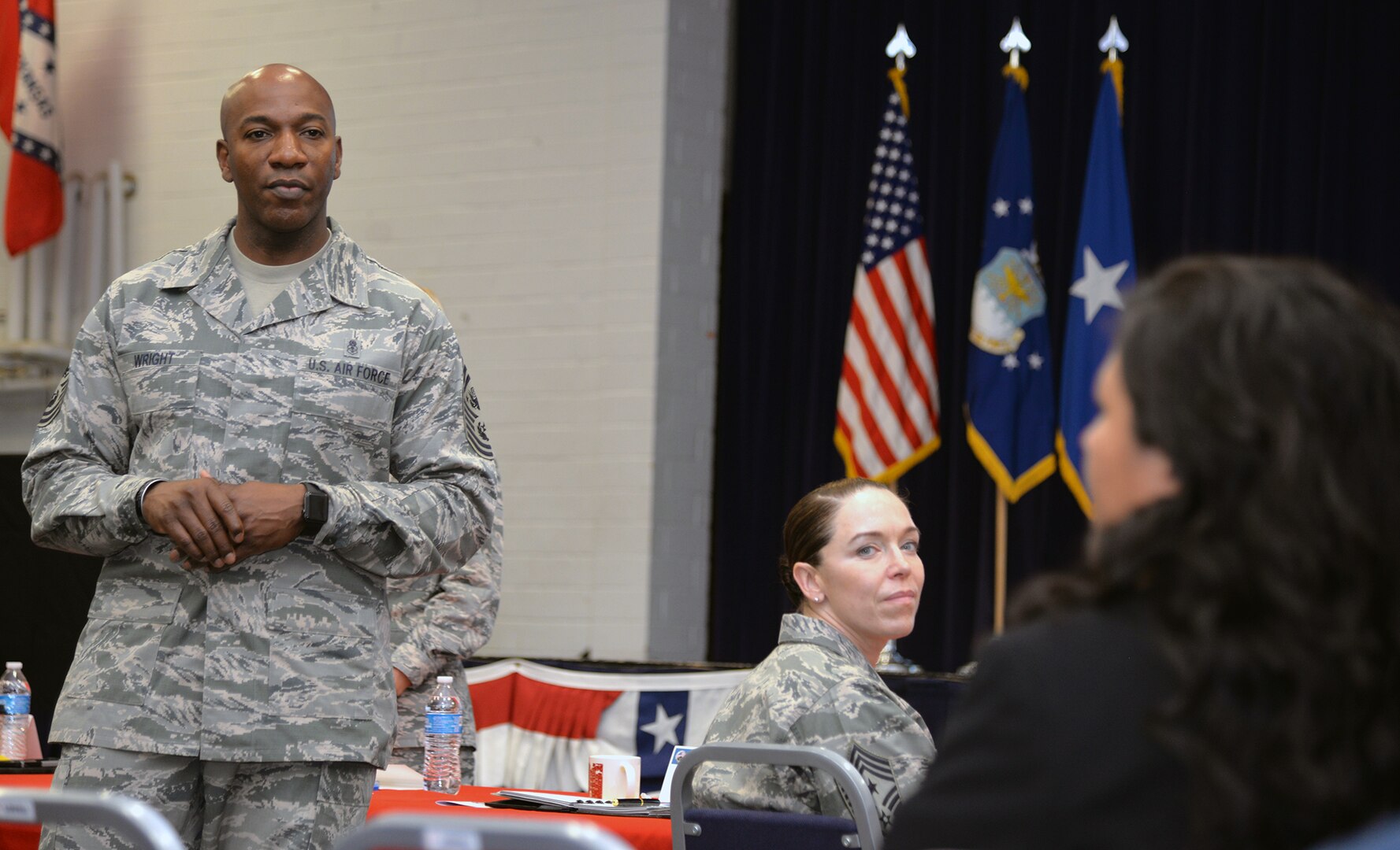 Chief Master Sgt. of the Air Force Kaleth O. Wright listens as Elizabeth Treon, 502nd Air Base Wing Military and Family Readiness Center director, discusses resources available to civilian employees Aug. 1 at Joint Base San Antonio-Fort Sam Houston. The Air Force's senior enlisted leader met with 502nd Air Base Wing leaders to learn about the installation support mission at Joint Base San Antonio.