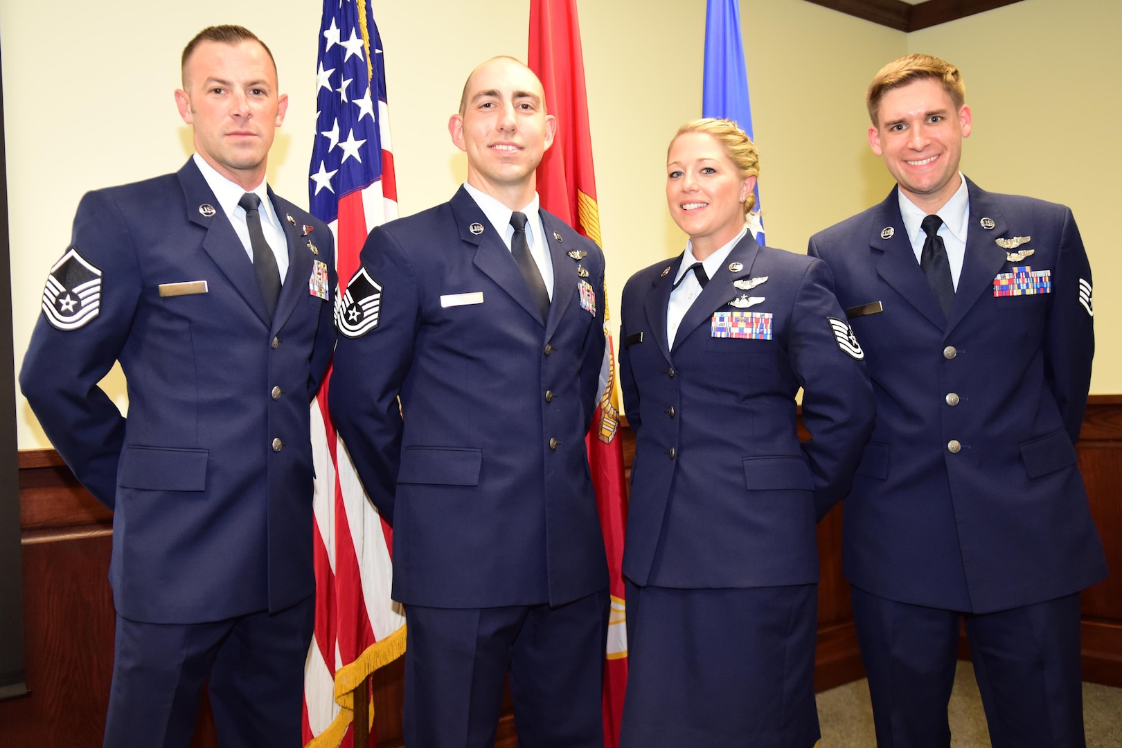 Master Sgt. Christopher, Master Sgt. Raymond, Tech Sgt. Courtney, and Staff Sgt. Matthew pose for a group photo after graduation from Remotely Piloted Aircraft Training at Joint Base San Antonio - Randolph.