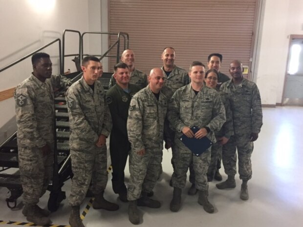 Staff Sgt. Wade Griffith, center right, and Staff Sgt. Matthew Graziano, center left, both 437th Maintenance Group C-17 Globemaster III maintenance instructors, are awarded the Diamond Sharp award by Joint Base Charleston first sergeants here July 21. Griffith and Graziano were selected for their above and beyond performance in training younger Airmen in maintenance career fields. The award is one way leadership strives to recognize top performing Airmen.