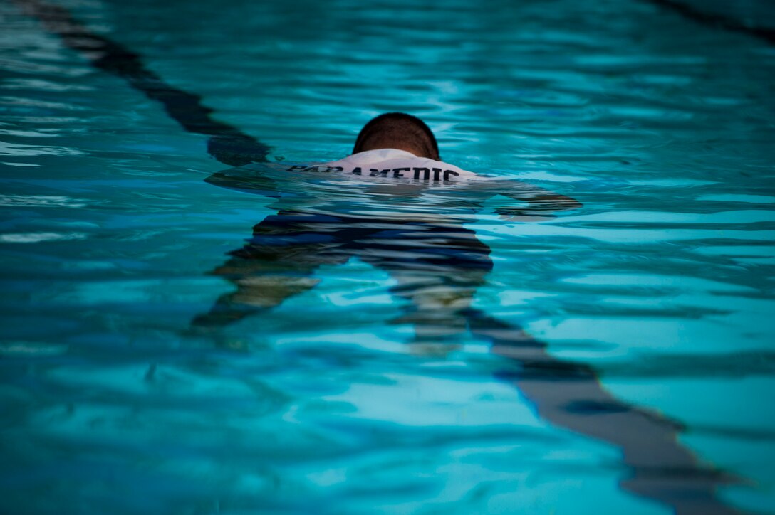 A simulated victim floats in a pool during emergency medical technician refresher training, Aug. 4, 2017, at Moody Air Force Base, Ga. During the five-day refresher training, 23d Medical Group Airmen learned how to perform cardiac arrest management, airway management, hemorrhage control and spinal immobilization. At the end of the course, Airmen were evaluated on their ability to perform medical and trauma patient assessments based on various emergency circumstances. (U.S. Air Force photo by Airman 1st Class Lauren M. Sprunk)