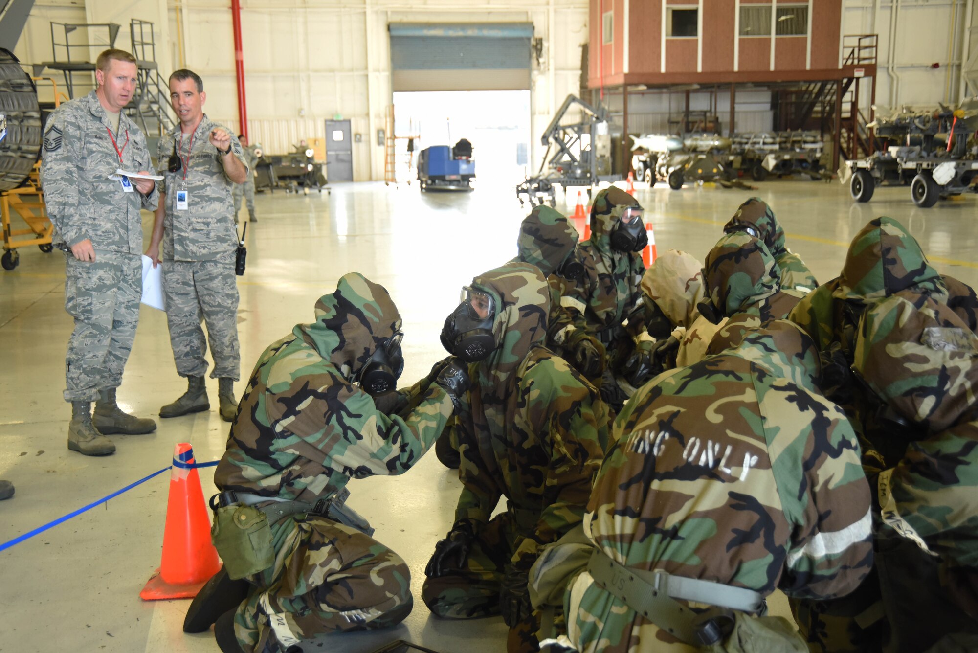 Airmen from the 301st Fighter Wing Mission Support Group prepare their gas masks to fit properly with an air-tight seal during an Ability to Survive and Operate (ATSO) training Saturday, Aug. 5, 2017 at Naval Air Station Fort Worth Joint Reserve Base, Texas. Annual exercises hone Airmen’s skills to continue executing the mission in austere conditions. (U.S. Air Force photo/ Tech. Sgt. Jeremy Roman)
