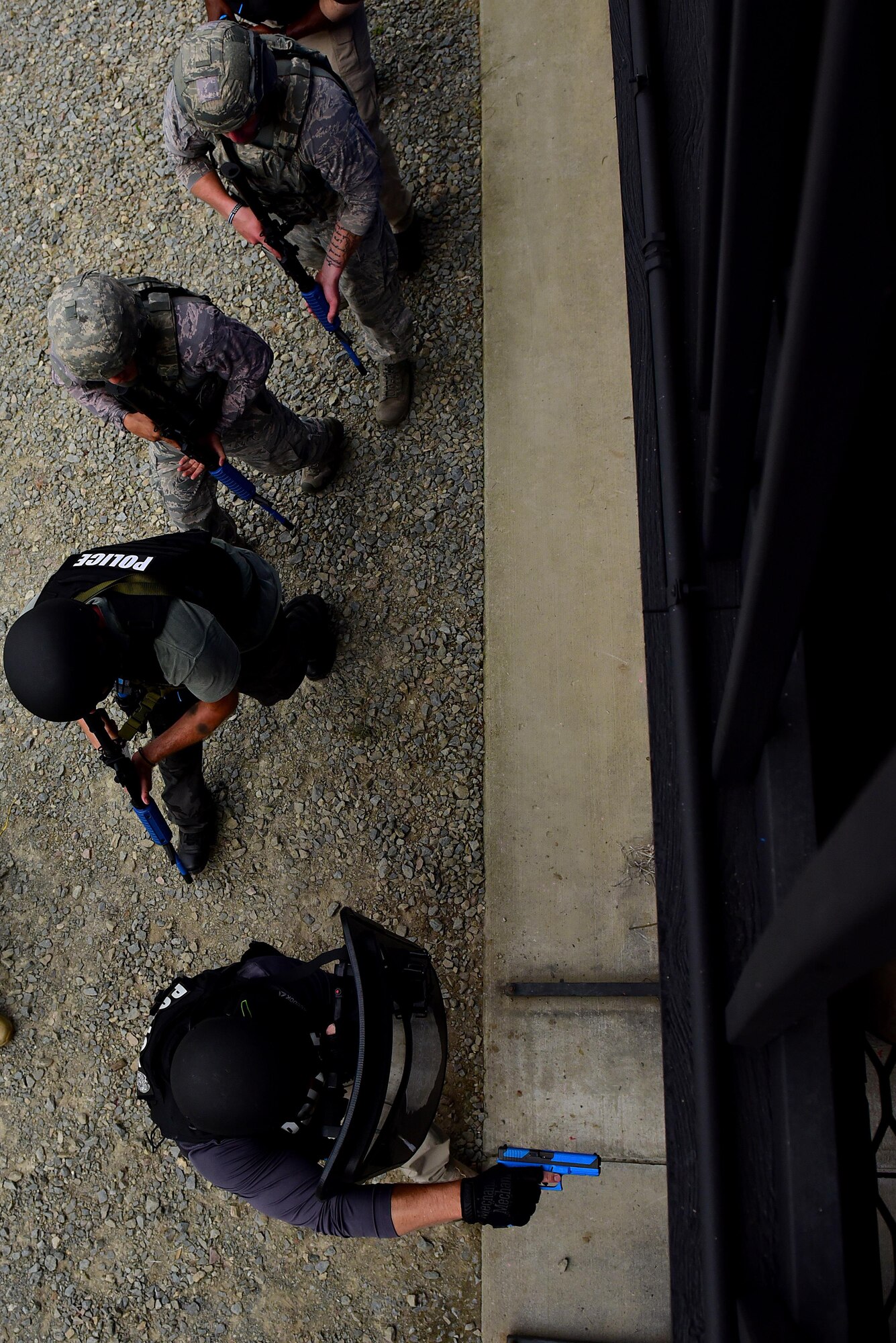 Students in a basic SWAT course prepare to enter a building with simulated hostiles inside, Aug. 3, 2017, at Seymour Johnson Air Force Base, North Carolina.