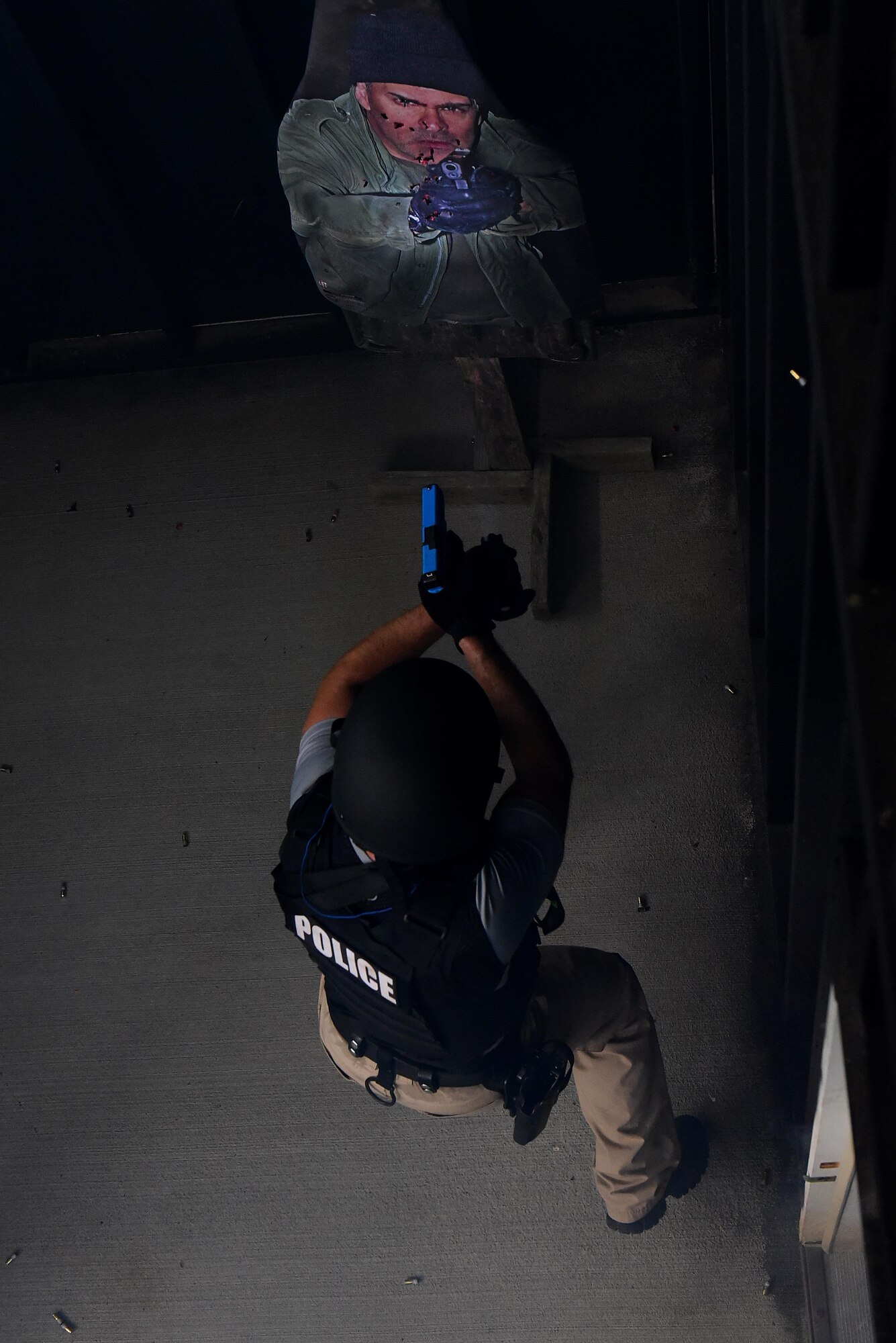 A Goldsboro Police Officer fires Simunition rounds at a hostile target during a basic SWAT course at the shoot-house on Seymour Johnson Air Force Base, North Carolina, Aug. 3, 2017.