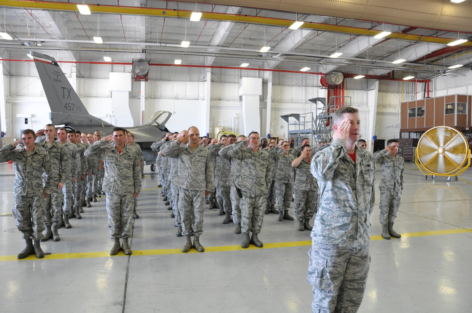 Airmen from the 301st Aircraft Maintenance Squadron salute Maj. Carla Martinez after she assumes command of the squadron at Naval Air Station Fort Worth Joint Reserve Base, Texas, Sunday, Aug. 6. 2017. The Assumption of Command Ceremony is a tradition that dates back to the 18th century. (U.S. Air Force photo by Tech. Sgt. Charles Taylor)