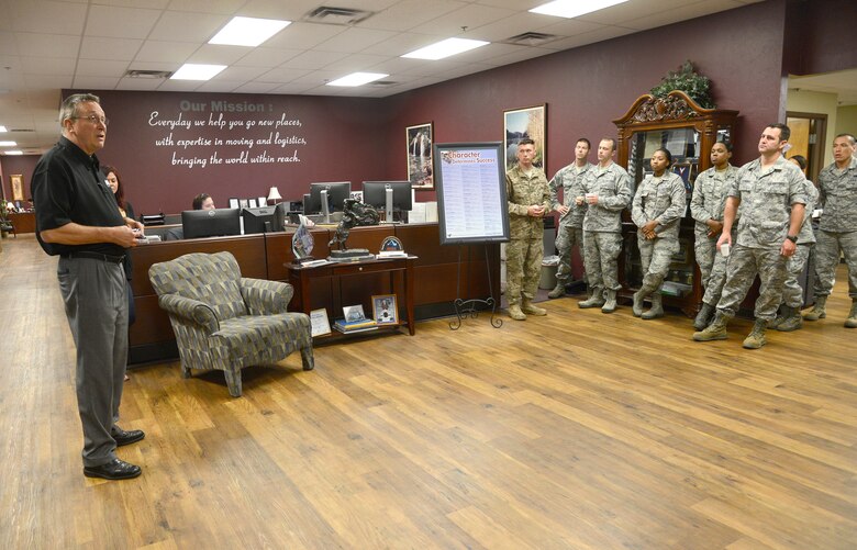 Members of the 919th Special Operations Logistics Readiness Squadron listen to David Howell, CEO of ACE Moving and Storage during a recent tour of their facility.