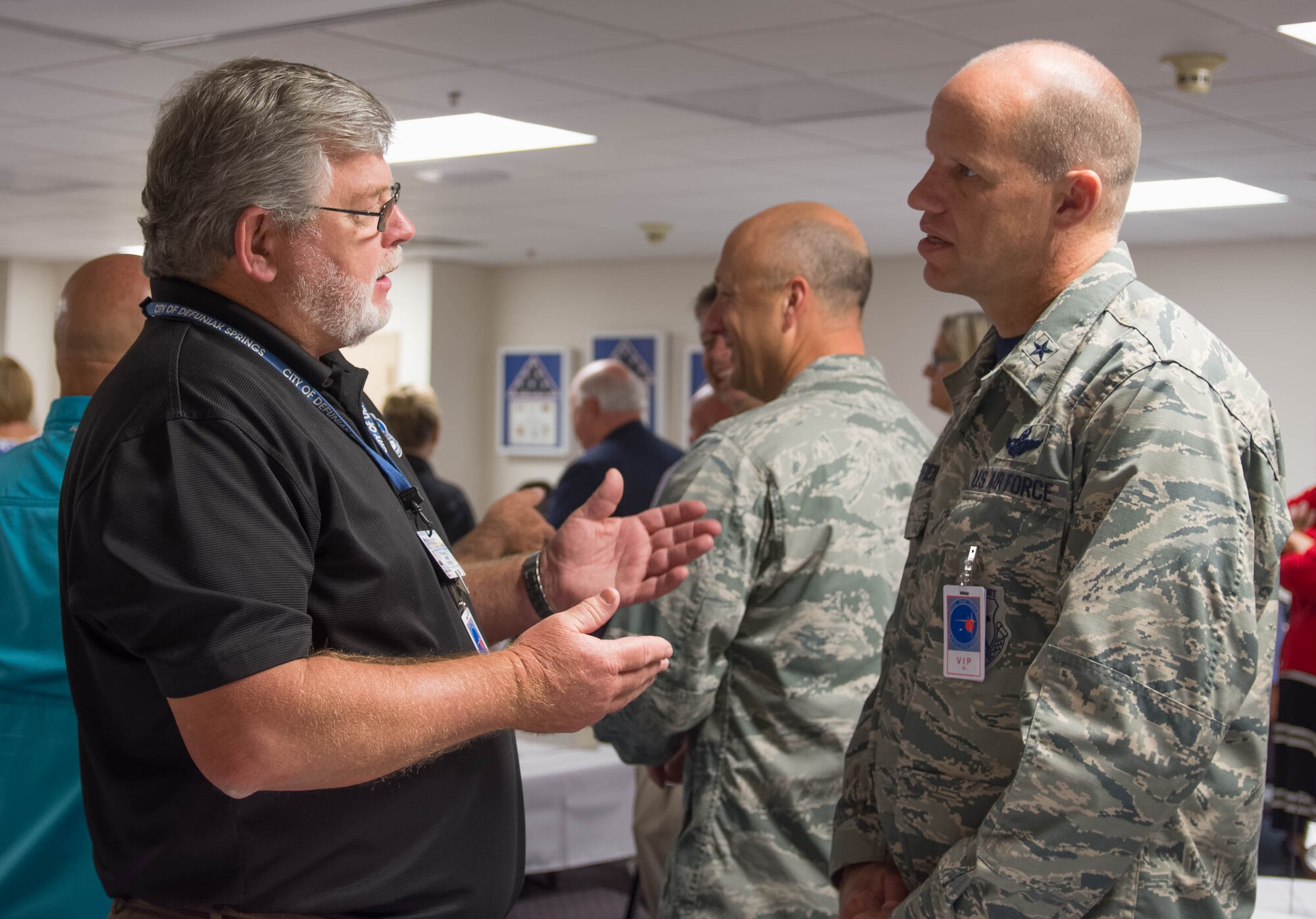 Brigadier General Evan Dertien, 96th Test Wing commander, converses with DeFuniak Springs Mayor Bob Campbell.