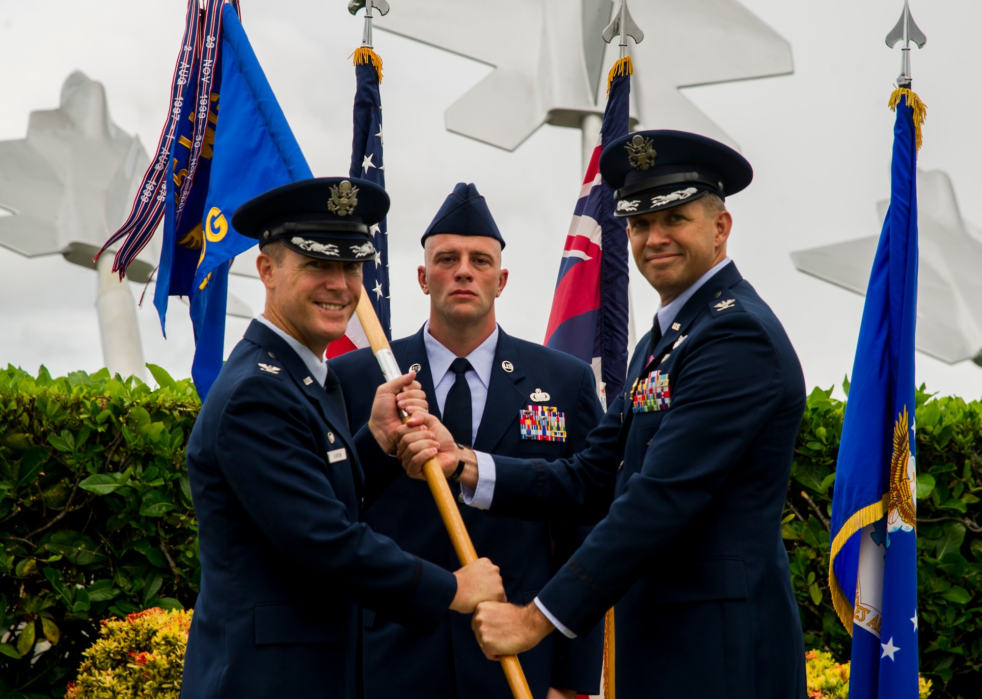 Col. Kevin Gordon, 15th Wing commander, takes the group flag from Col. Christopher Paige, 15th Medical Group outgoing commander, during the 15th Medical Group’s change of command on Joint Base Pearl Harbor-Hickam, Hawaii, Aug. 1, 2017. The 15th Medical Group provides outpatient healthcare to the Hickam community and maintains operational ready forces through wellness and primary healthcare. (U.S. Air Force photo by Tech. Sgt. Heather Redman)