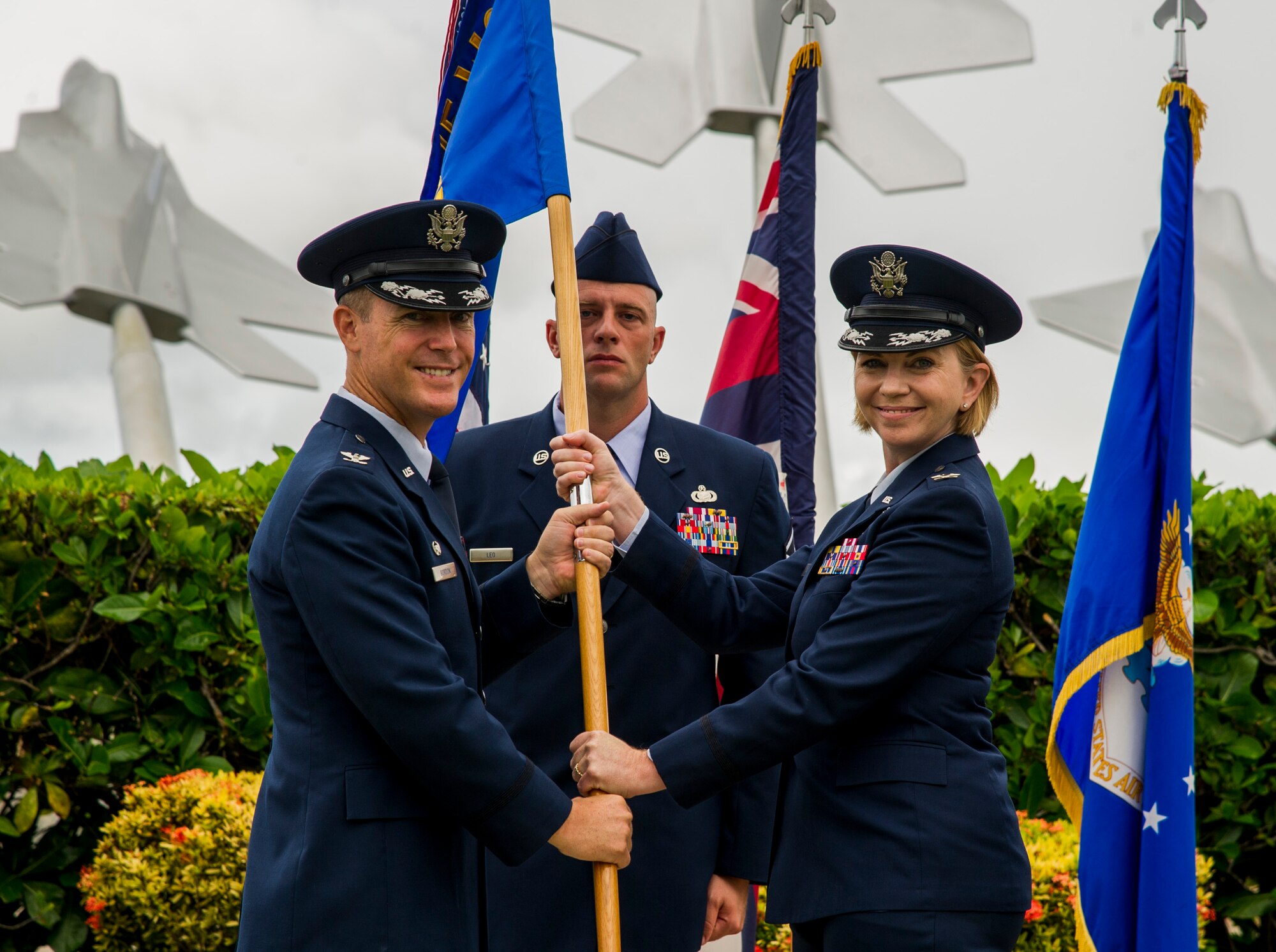 Col. Kevin Gordon, 15th Wing commander, gives the group flag to Col. Kara Gormont, 15th Medical Group incoming commander, during the 15th Medical Group’s change of command on Joint Base Pearl Harbor-Hickam, Hawaii, Aug. 1, 2017. The 15th Medical Group provides outpatient healthcare to the Hickam community and maintains operational ready forces through wellness and primary healthcare. (U.S. Air Force photo by Tech. Sgt. Heather Redman)