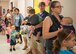 Parents and chilren wait to enter the nutrition and fitness station during the first Teddy Bear Clinic at Eglin Air Force Base, Aug. 4. Children took their stuffed animals and characters through eight clinic stations. Stations included registration, CPR, immunizations, nutrition, fitness and vital signs. The Pediatric Clinic hosted 127 children to educate them about hospital procedures and to demonstrate what they may expect if they need to see a doctor. (U.S. Air Force photo/Ilka Cole)