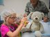 Six-year-old, Darcey McCormack, gives her teddy bear an immunization during the first Teddy Bear Clinic at Eglin Air Force Base, Aug. 4. Children took their stuffed animals and characters through eight clinic stations. Stations included registration, CPR, immunizations, nutrition, fitness and vital signs. The Pediatric Clinic hosted 127 children to educate them about hospital procedures and to demonstrate what they may expect if they need to see a doctor. (U.S. Air Force photo/Ilka Cole)