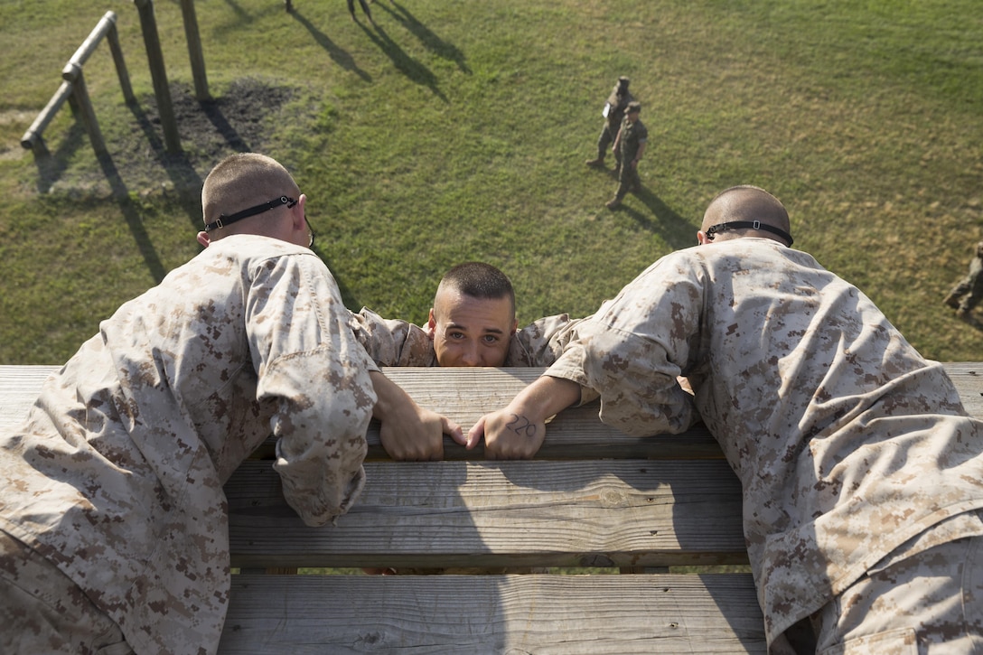 U.S. Marine Corps candidates with Officer Candidates school (OCS) participate in the Tarzan Course and Confidence course at OCS, Marine Corps Base Quantico, Va., on March 10, 2016. The mission of OCS is to educate and train officer candidates in Marine Corps knowledge and skills within a controlled and challenging environment in order to evaluate and screen individuals for the leadership qualities required for commissioning as a Marine Corps officer.(U.S. Marine Corps photo by Lance Cpl. Yasmin D. Perez)