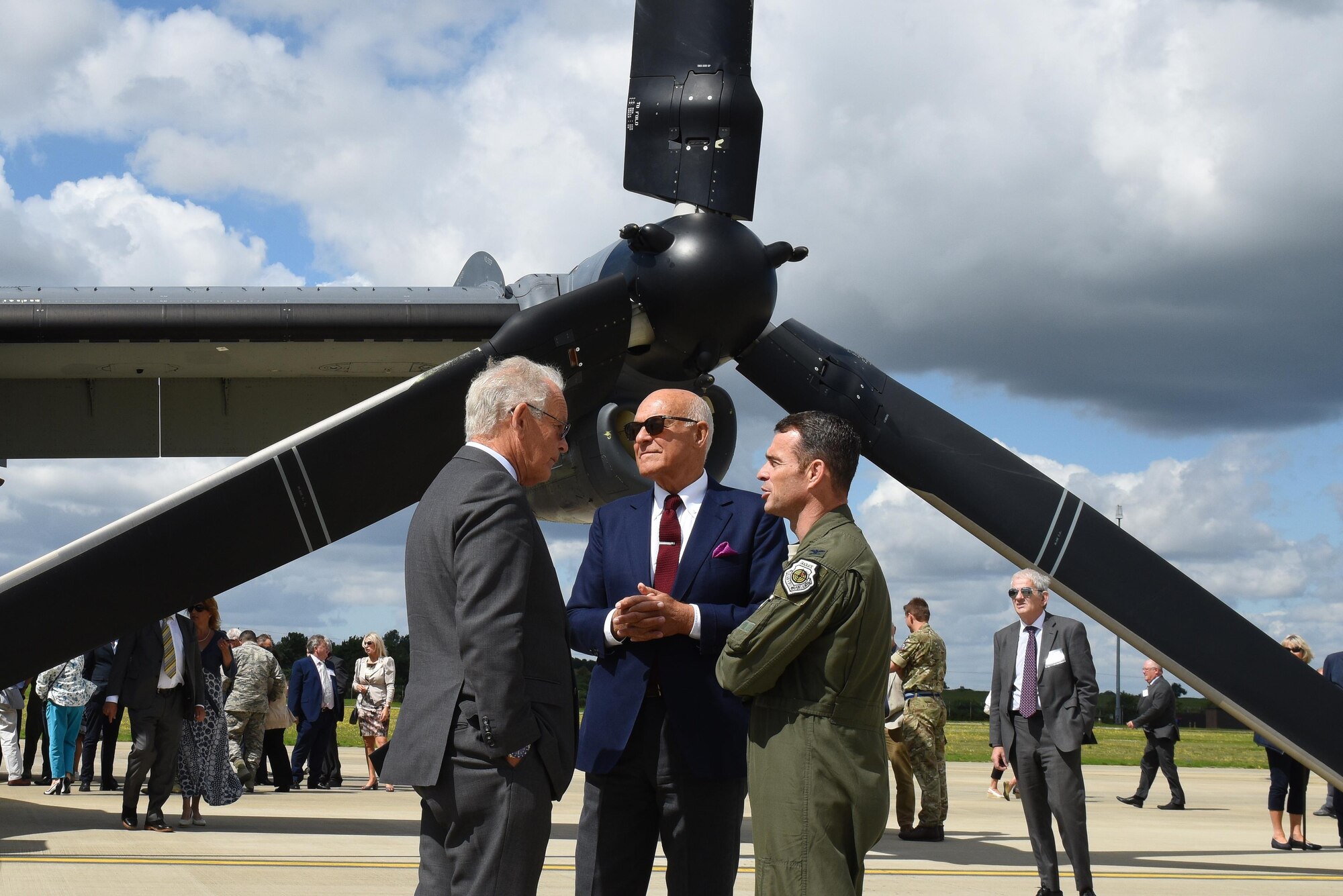 Terry Holloway, 48th Maintenance Group honorary commander, left, and John Cushing, Royal Air Force Lakenheath British American Committee chairman, center, speak with Col. John A. Kent IV, 48th Fighter Wing vice commander, right, during the civic summer event at RAF Lakenheath, England, Aug. 4. It was first time the 48th Fighter Wing, 100th Air Refueling Wing and 352nd Special Operations Wing co-hosted the event. (U.S. Air Force photo/Airman 1st Class Abby L. Finkel)