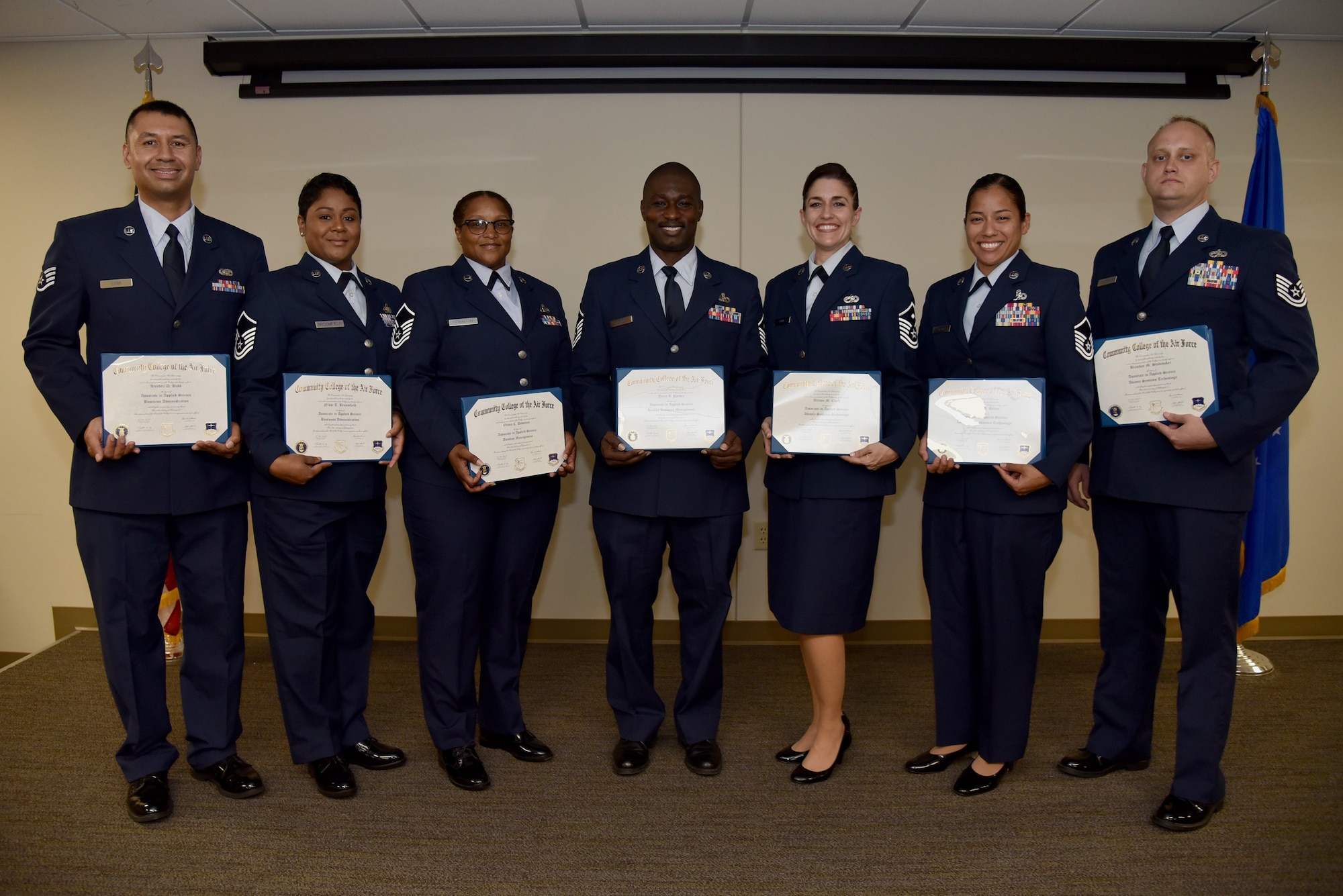 Community College of the Air Force graduates assigned to the 927th Air Refueling Wing walked across the stage and received their diplomas during a ceremony held on Aug. 6, 2017, at MacDill Air Force Base, Florida. Each year, CCAF students earn more than 1.6 million hours of college credits, and the college has awarded more than 335,000 degrees since 1977. (U.S. Air Force photo by Staff Sgt. Nicholas Monteleone)