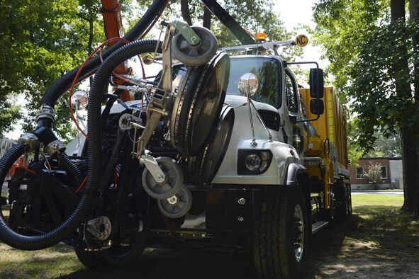U.S. Air Force Airmen are given a look at the new Stripe Hog water blasting system vehicle during the Vehicle Transformation and Acquisition Council at Joint Base Langley-Eustis, Va., Aug. 2, 2017. The vehicle removes built-up rubber at the end of the flightline and recycles it into other products such as tires and engine belts. (U.S. Air Force photo/Airman 1st Class Kaylee Dubois)