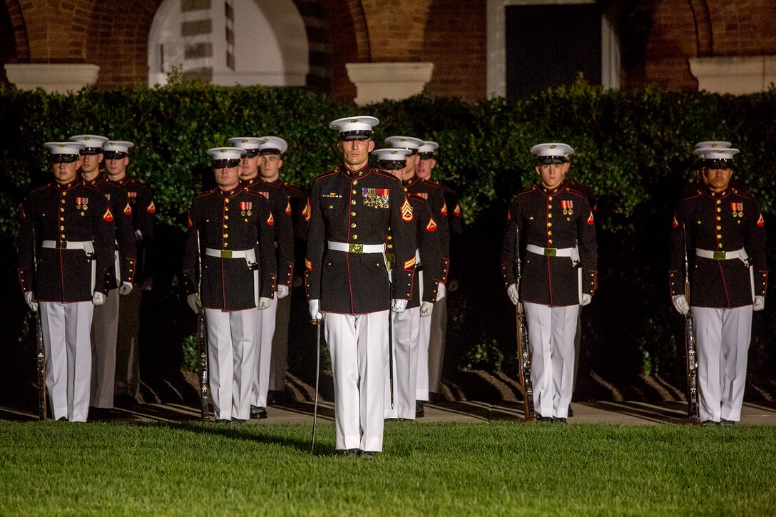 Staff Sgt. James M. Finney, acting platoon commander, 1st platoon, Alpha Company, Marine Barracks Washington D.C., stands at attention during the Staff Noncommissioned Officer Evening Parade at Marine Barracks Washington D.C., Aug. 4, 2017. The guest of honor for the parade was retired Marine Corps Col. Archie Simpson, Guadalcanal veteran, and the hosting official was Lt. Gen. James B. Laster, director, Marine Corps Staff. (Official Marine Corps photo by Cpl. Robert Knapp/Released)
