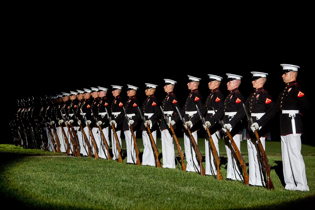 Marines of the U.S. Marine Corps Silent Drill Platoon execute their “long line” sequence during the Staff Noncommissioned Officer Evening Parade at Marine Barracks Washington D.C., Aug. 4, 2017. The guest of honor for the parade was retired Marine Corps Col. Archie Simpson, Guadalcanal veteran, and the hosting official was Lt. Gen. James B. Laster, director, Marine Corps Staff. (Official Marine Corps photo by Cpl. Robert Knapp/Released)