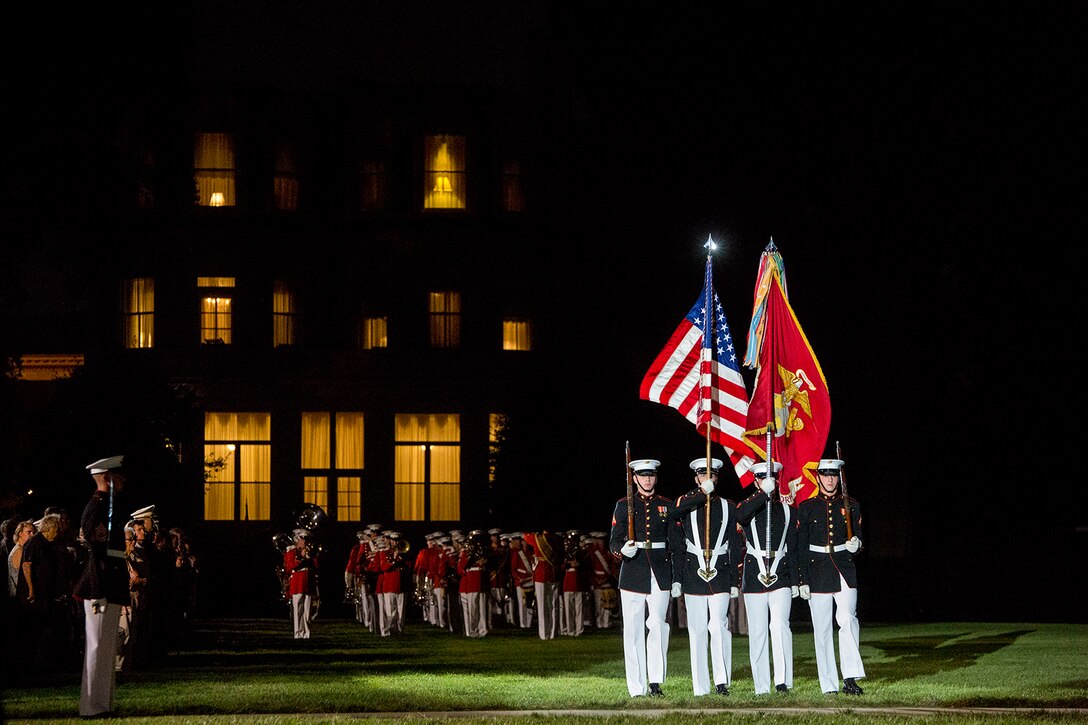 The U.S. Marine Corps Color Guard marches across the parade deck during the Staff Noncommissioned Officer Evening Parade at Marine Barracks Washington D.C., Aug. 4, 2017. The guest of honor for the parade was retired Marine Corps Col. Archie Simpson, Guadalcanal veteran, and the hosting official was Lt. Gen. James B. Laster, director, Marine Corps Staff. (Official Marine Corps photo by Cpl. Robert Knapp/Released)