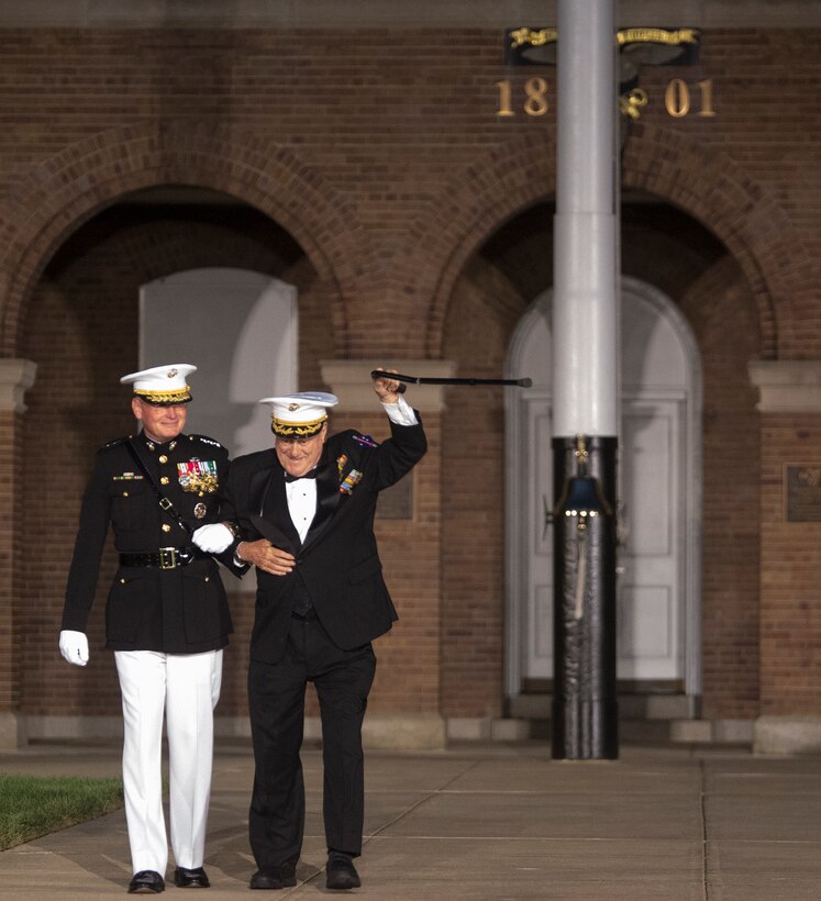 The guest of honor and hosting official are introduced to the attendees during the Staff Noncommissioned Officer Evening Parade at Marine Barracks Washington D.C., Aug. 4, 2017. The guest of honor for the parade was retired Marine Corps Col. Archie Simpson, Guadalcanal veteran, and the hosting official was Lt. Gen. James B. Laster, director, Marine Corps Staff. (Official Marine Corps photo by Cpl. Robert Knapp/Released)