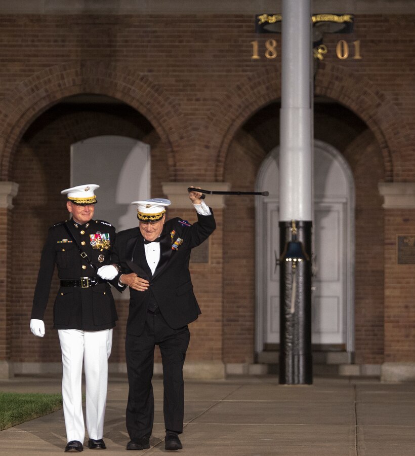 The guest of honor and hosting official are introduced to the attendees during the Staff Noncommissioned Officer Evening Parade at Marine Barracks Washington D.C., Aug. 4, 2017. The guest of honor for the parade was retired Marine Corps Col. Archie Simpson, Guadalcanal veteran, and the hosting official was Lt. Gen. James B. Laster, director, Marine Corps Staff. (Official Marine Corps photo by Cpl. Robert Knapp/Released)
