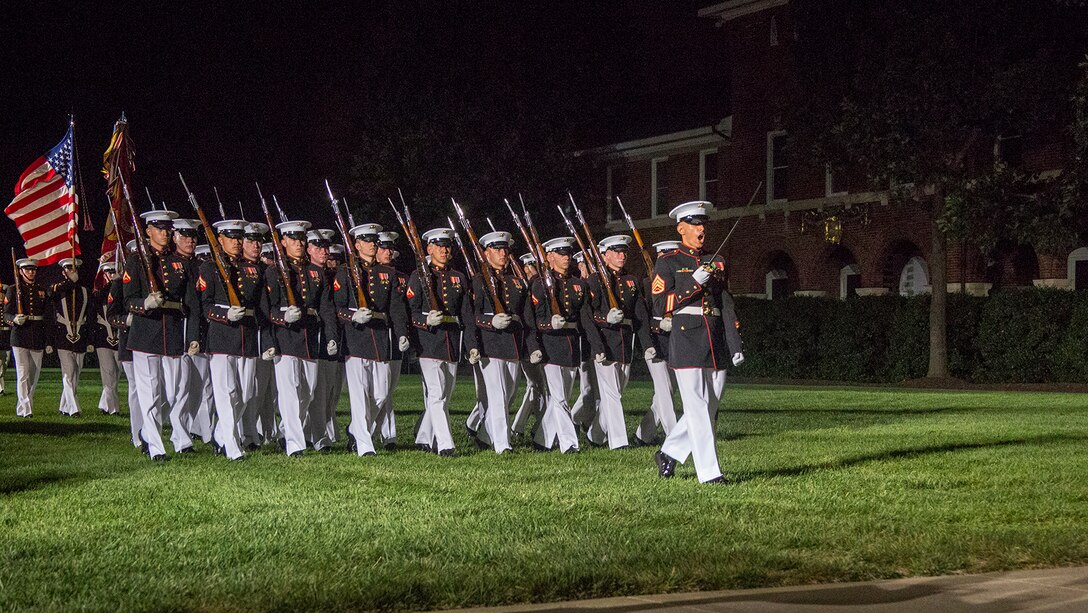 Staff Sgt. Said Lemarhi, platoon sergeant, U.S. Marine Corps Silent Drill Platoon, marches his platoon across the parade deck as a part of “pass and review” during the Staff Noncommissioned Officer Evening Parade at the Barracks, Aug. 4, 2017. The guest of honor for the parade was retired Marine Corps Col. Archie Simpson, Guadalcanal veteran, and the hosting official was Lt. Gen. James B. Laster, director, Marine Corps Staff. (Official Marine Corps photo by Cpl. Robert Knapp/Released)