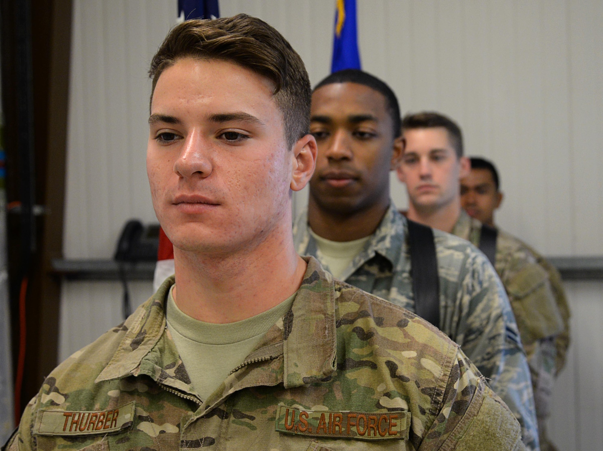 Team Mildenhall honor guardsmen practice the ceremonial presenting of the colors July 28, 2017, on RAF Mildenhall, England. While progressing in their respective career fields, the RAF Mildenhall honor guard members also commit about 16 hours of training and up to 30 hours of details a month. The details include changes of command, retirements and funeral ceremonies. (U.S. Air Force photo by Senior Airman Justine Rho)