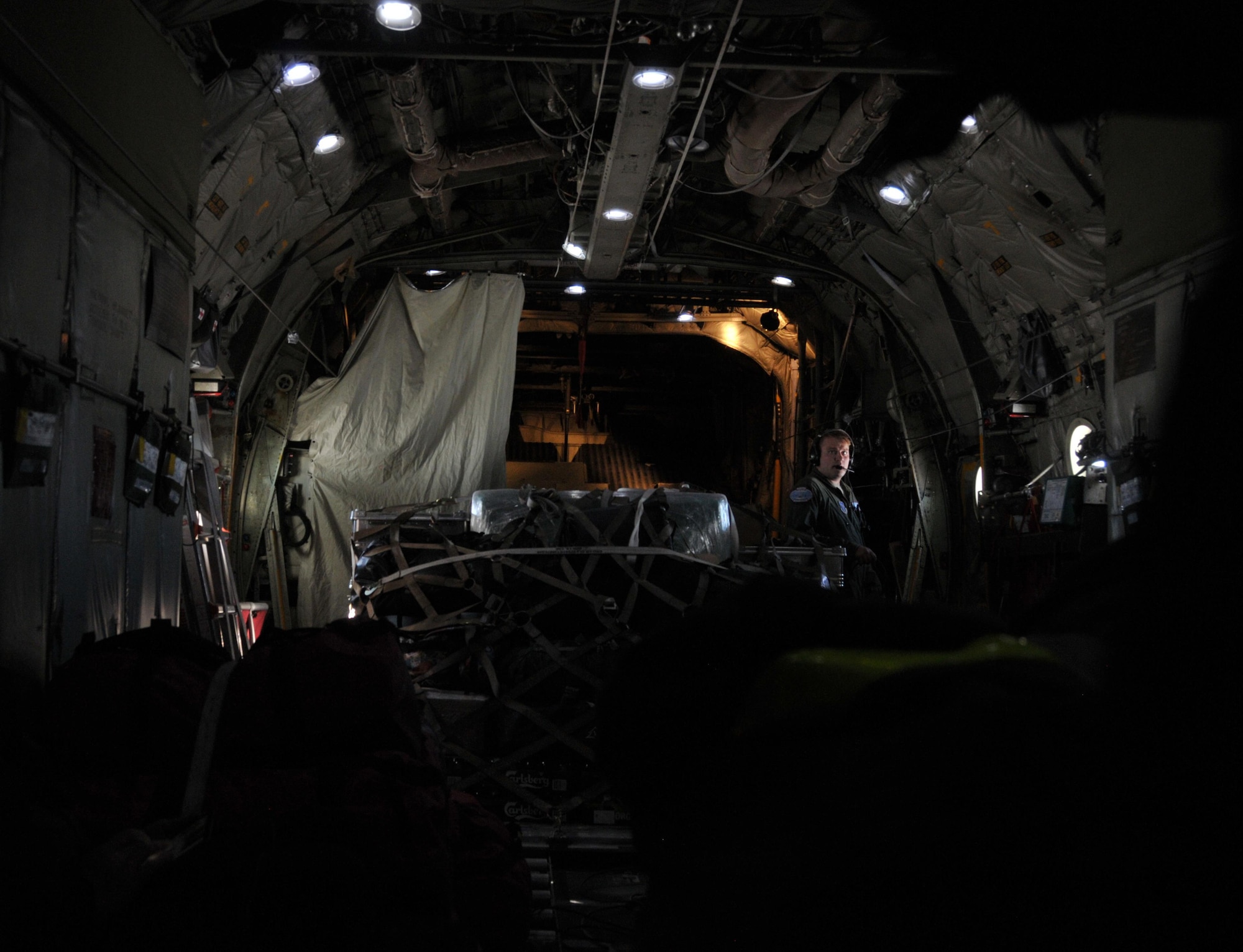 Airman 1st Class Ryan Rhoades, a student loadmaster with the 139th Airlift Squadron, on a flight to East GRIP (East Greenland Ice-core Project) from Kangerlussuaq, Greenland, on July 29, 2017. That was the 13th mission the 109th Airlift Wing made to East GRIP this season to transport cargo and scientists.  (U.S. Air National Guard photo by Master Sgt. Catharine Schmidt/Released)