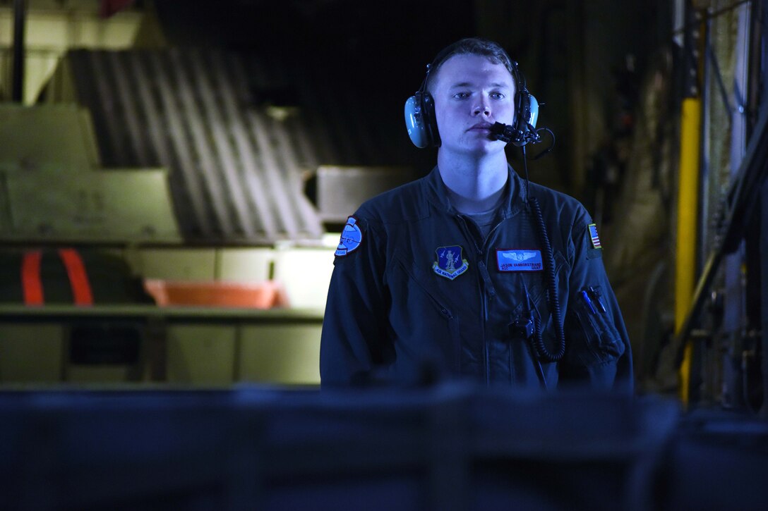 Airman 1st Class Jason Vannostrand communicates with LC-130 Skibird pilots before landing at Raven Camp.