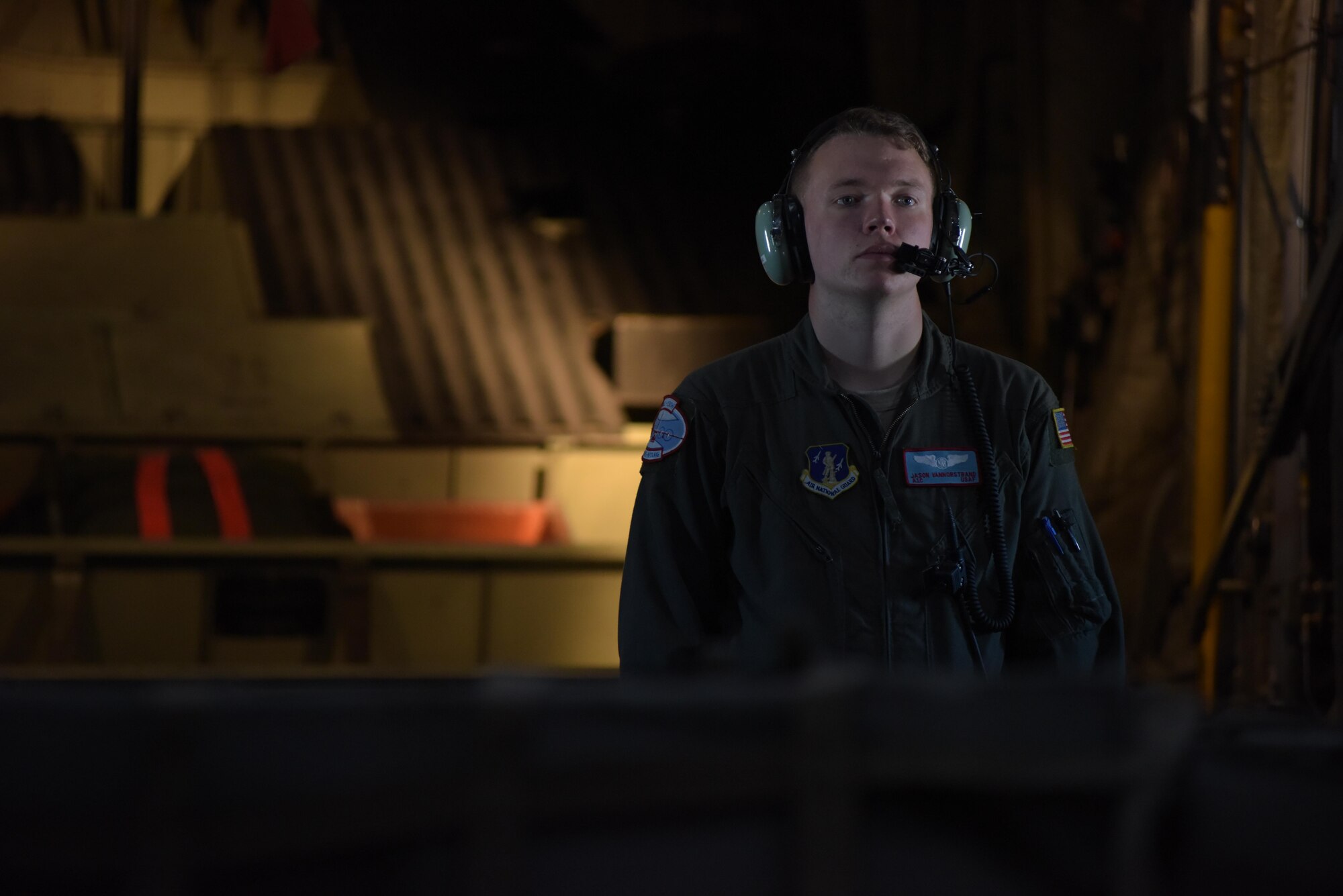 Airman 1st Class Jason Vannostrand, a student loadmaster with the 139th Airlift Squadron, on a training flight to Raven Camp, Greenland, from Kangerlussuaq, Greenland, on July 28, 2017. Raven Camp is used to train aircrews on LC-130 operations on a skiway. (U.S. Air National Guard photo by Senior Airman Jamie Spaulding/Released)